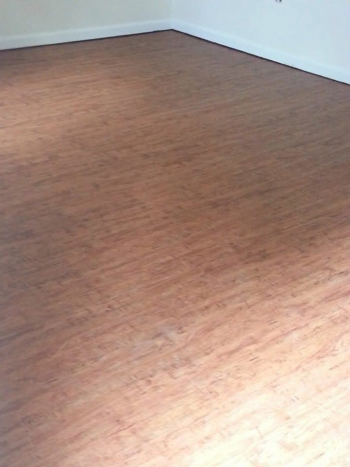 Finished wood-look plank flooring in a sunlit room