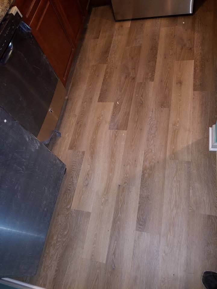 Finished flooring leading toward a staircase